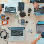 An overhead view of a tech startup working at a table