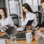 three professionals having a meeting in an office.