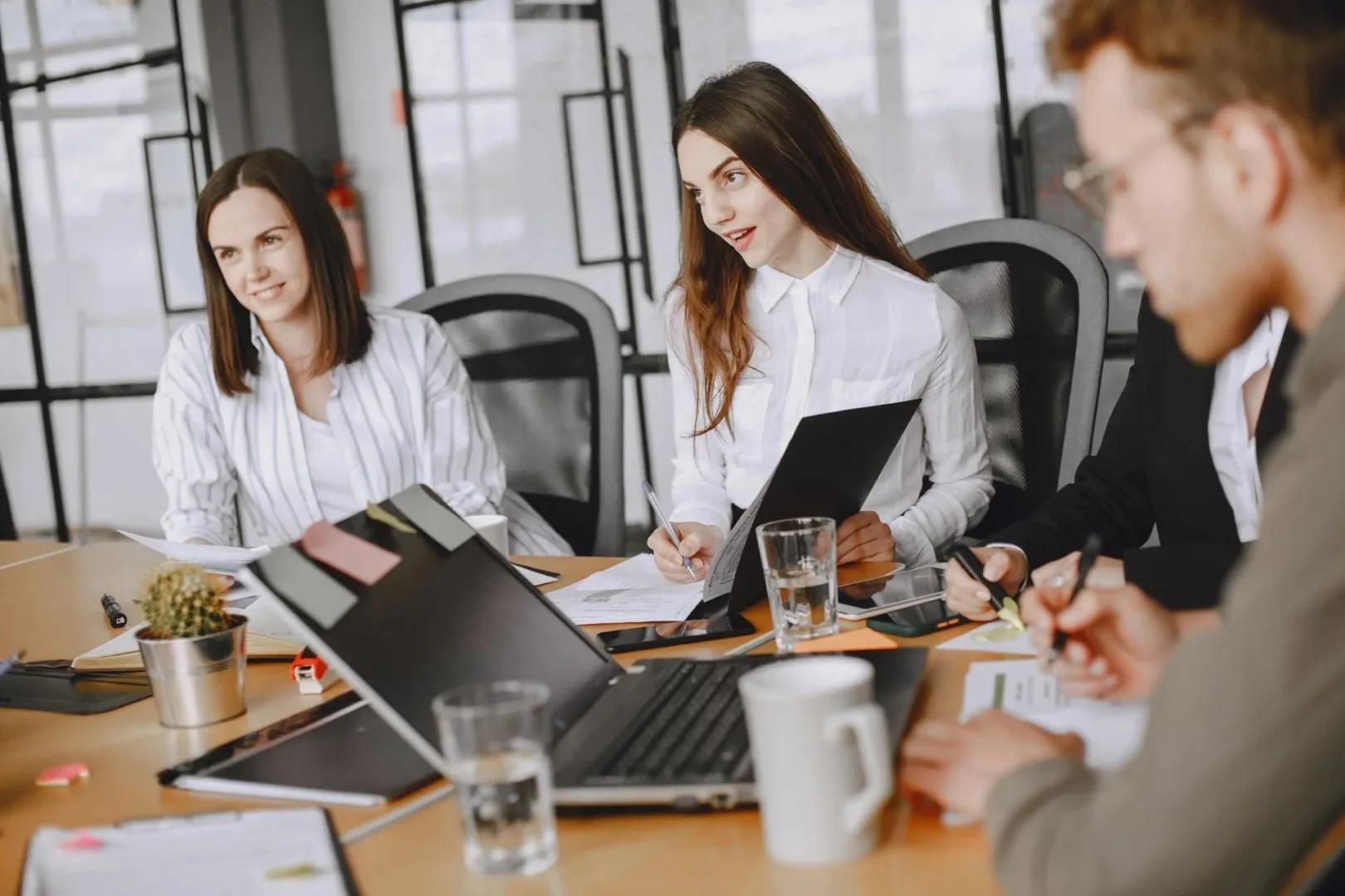 three professionals having a meeting in an office.